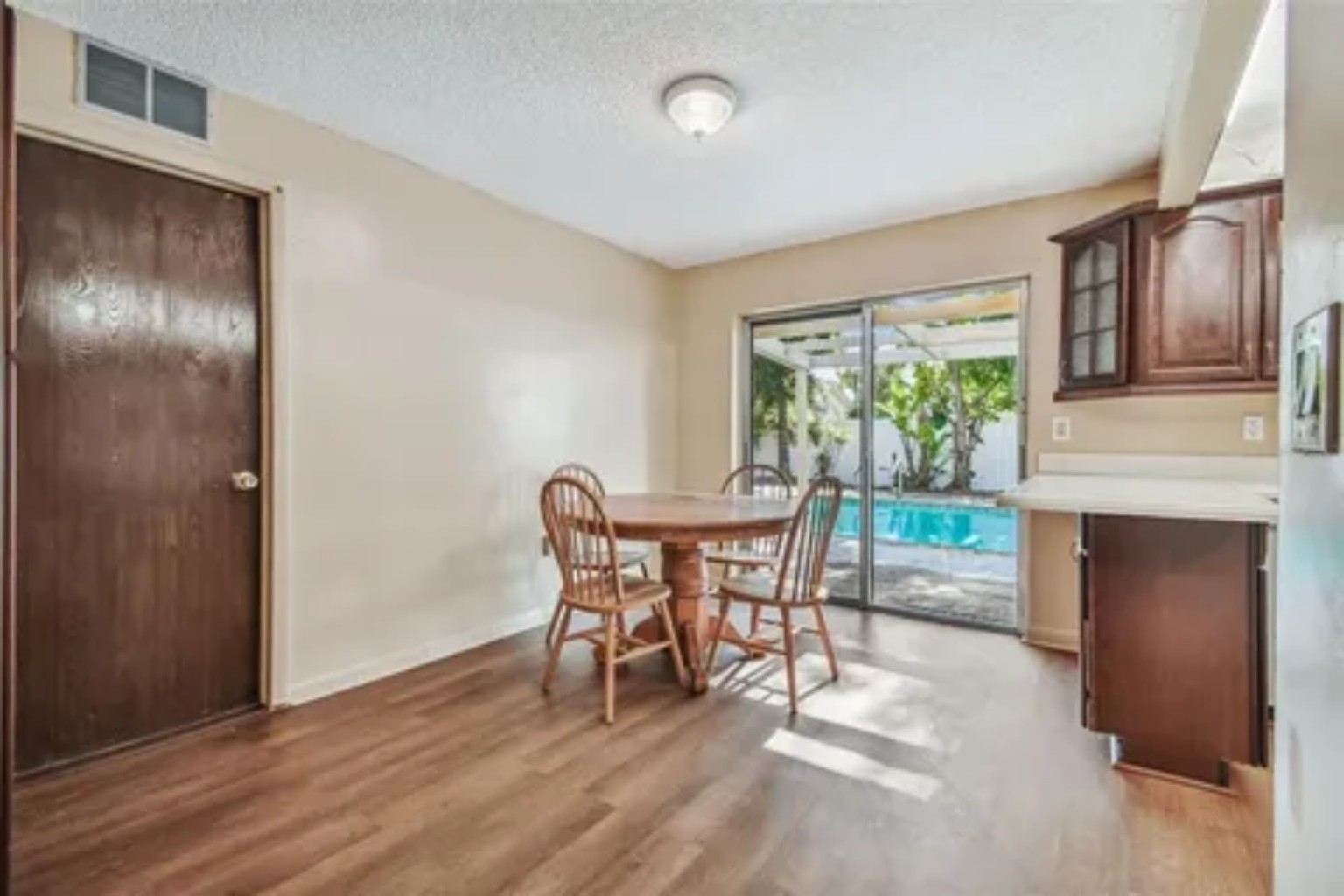 Before photo of dining area next to kitchen
