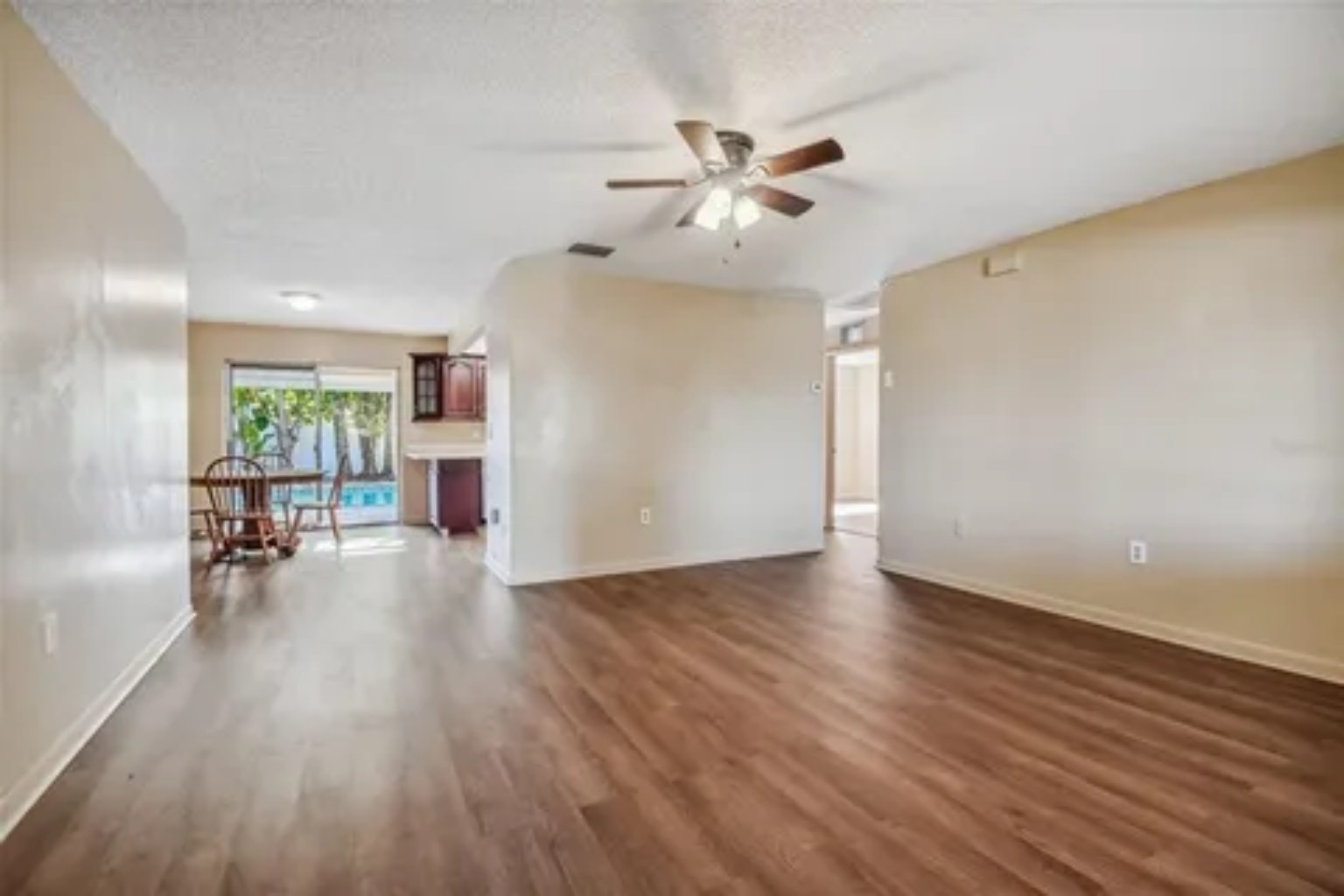 Before photo of living area connected to kitchen